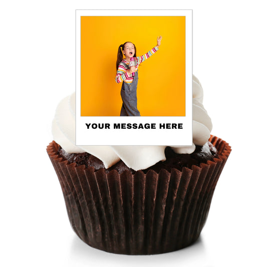 A custom photo cupcake topper displayed on top of a chocolate cupcake with white frosting. The topper features a printed photo of a girl against a yellow background, with the text 'YOUR MESSAGE HERE' below it, all on a clean white background.