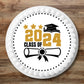 Class of 2024 Round Edible cake Topper on a white iced cake 