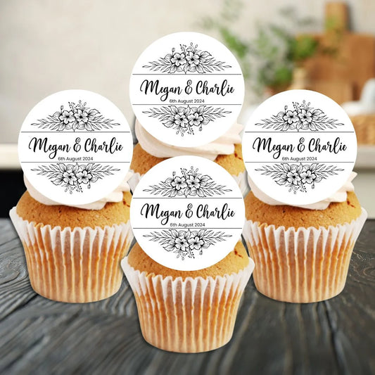 personalised monochrome floral edible cupcake topper design standing upright on frosted cakes