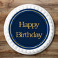 navy blue edible cake topper with gold happy birthday message, placed on a white iced cake