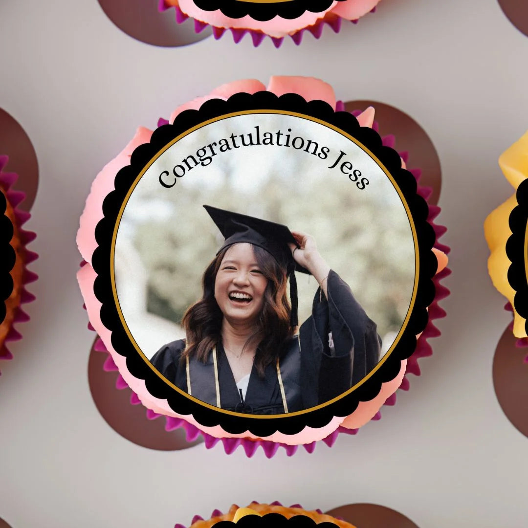 Personalised graduation cupcake topper with custom message and image, placed on pink frosted cupcakes