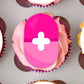 close up of a pink pill shaped Edible Cupcake Topper