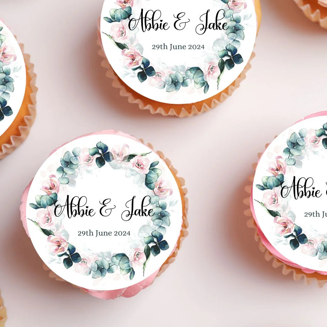 Pink floral and botanical personalised cupcake toppers on pink frosted cupcakes