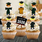 Cupcakes with graduation-themed toppers and a 'Class of 2026' sign.