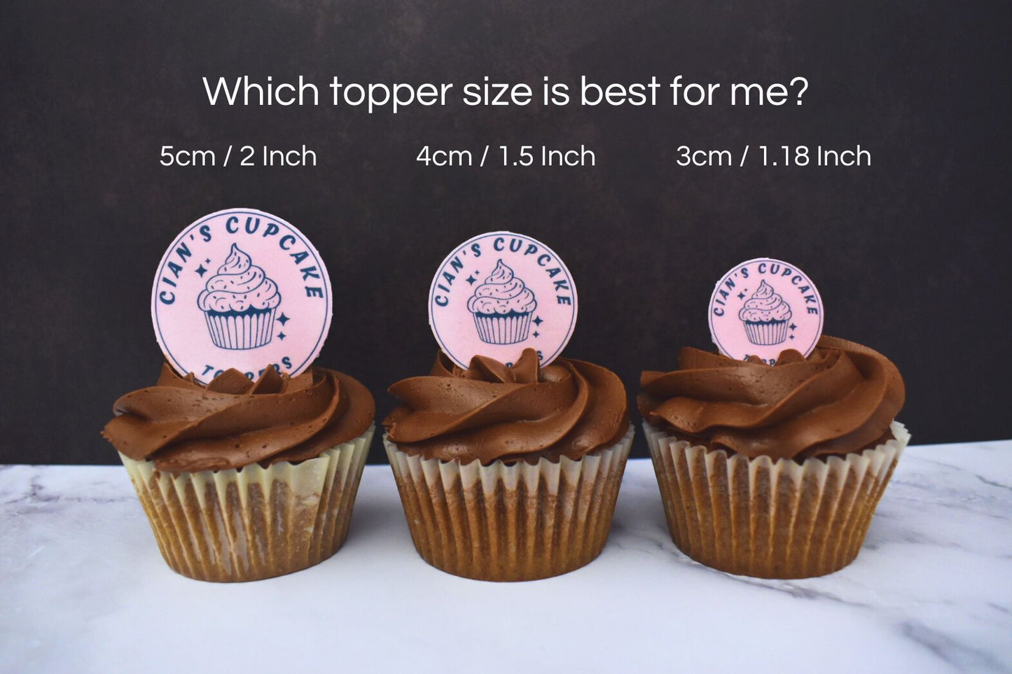Chocolate cupcakeswith different sizes cupcake toppers in the icing, to display how the different sizes look