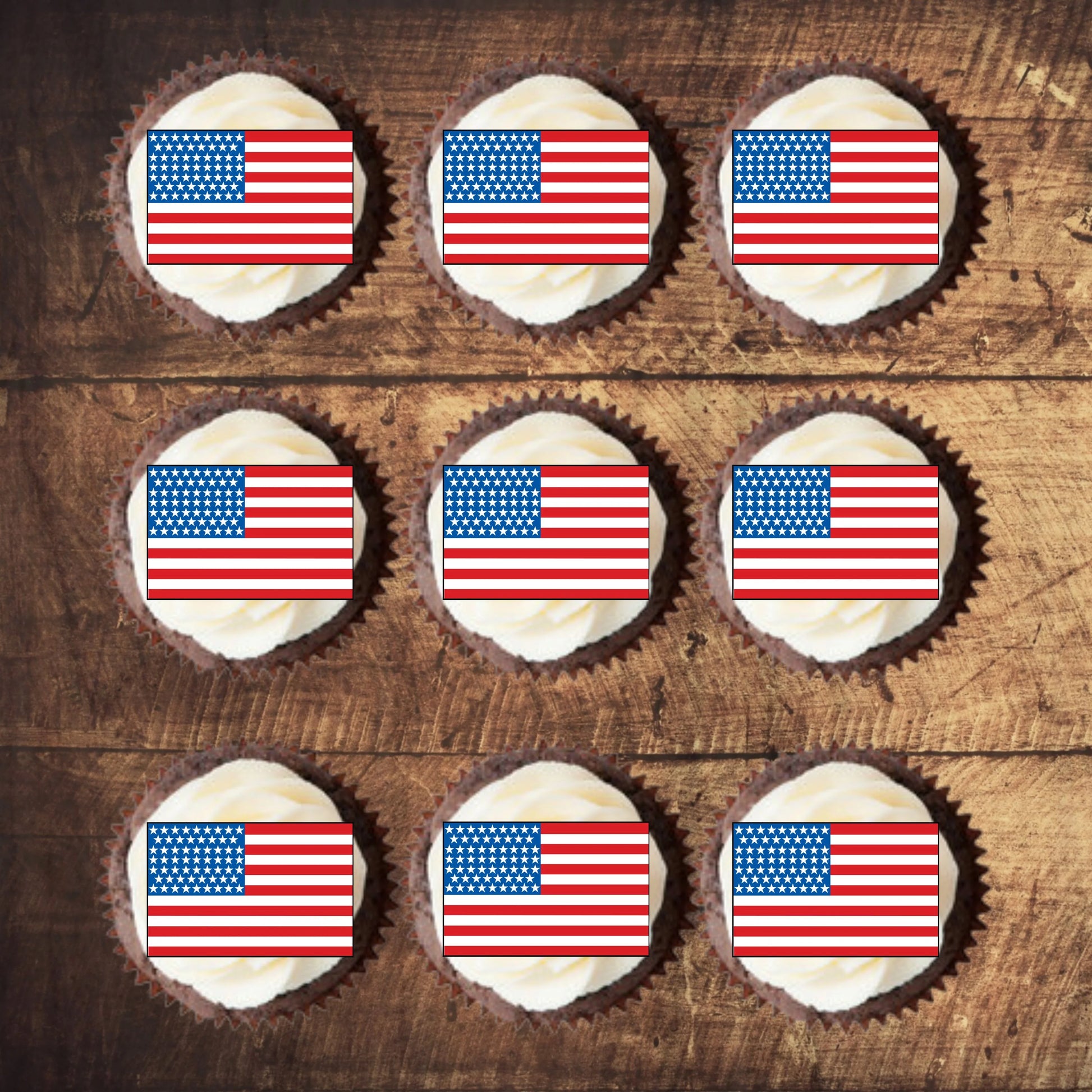 top view of American Flag Edible Cupcake Toppers on nine frosted cupcakes  