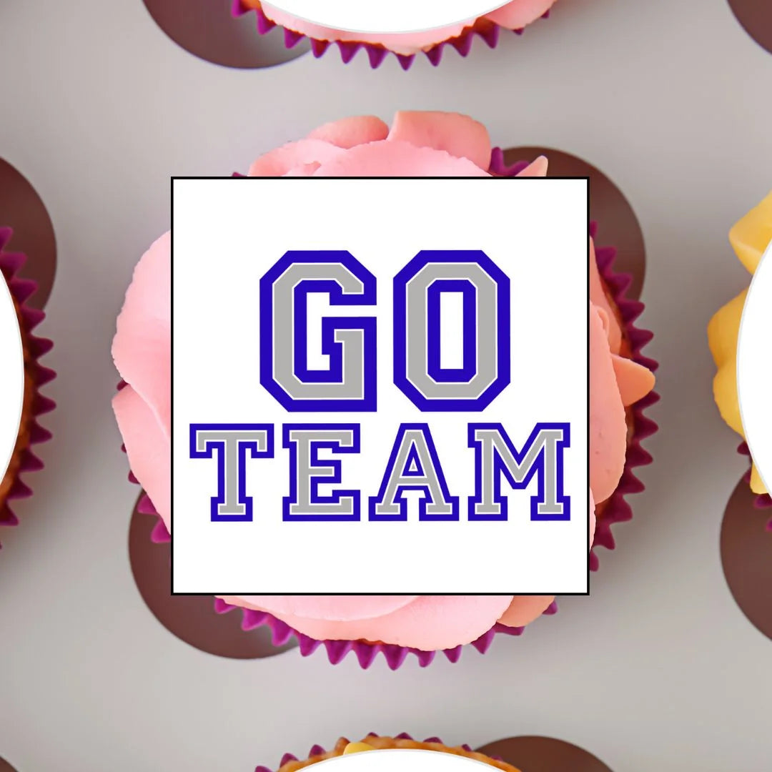 close up of a blue and silver 'go team' cupcake topper on a pink frosted cupcake