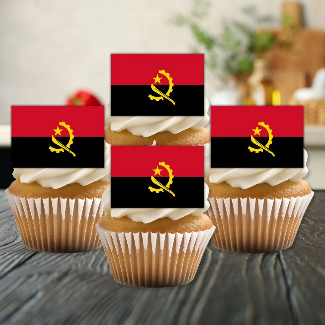 close up of angola  Flag Edible Cupcake Toppers on sponge cupcakes with white frosting 