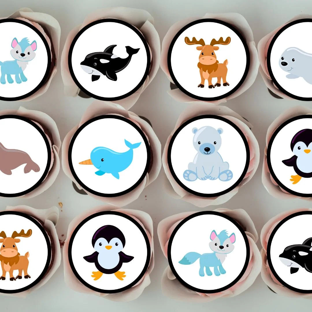 top down view of chocolate cupcakes with arctic themed animal cake toppers 