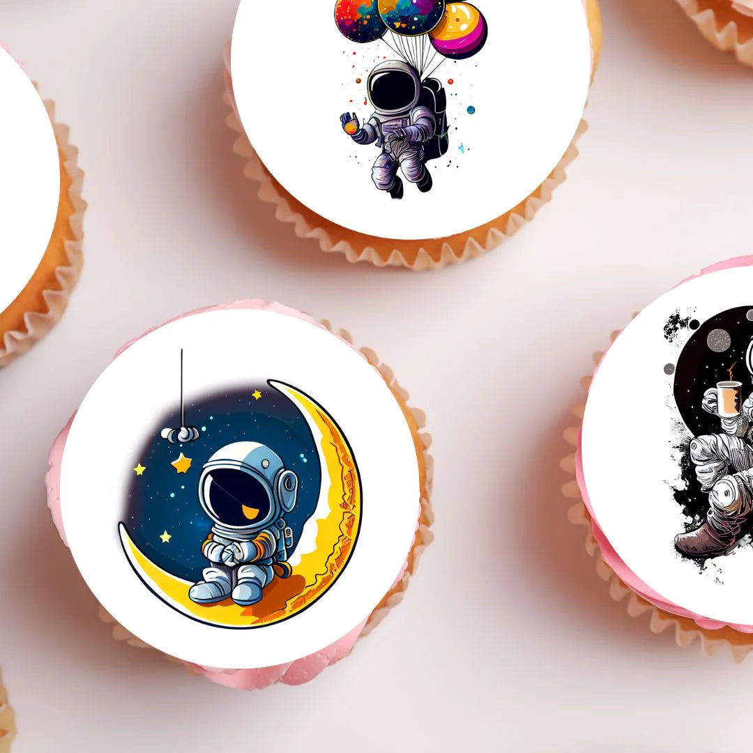 Astronaut Edible Cupcake Toppers on pink frosted cupcakes
