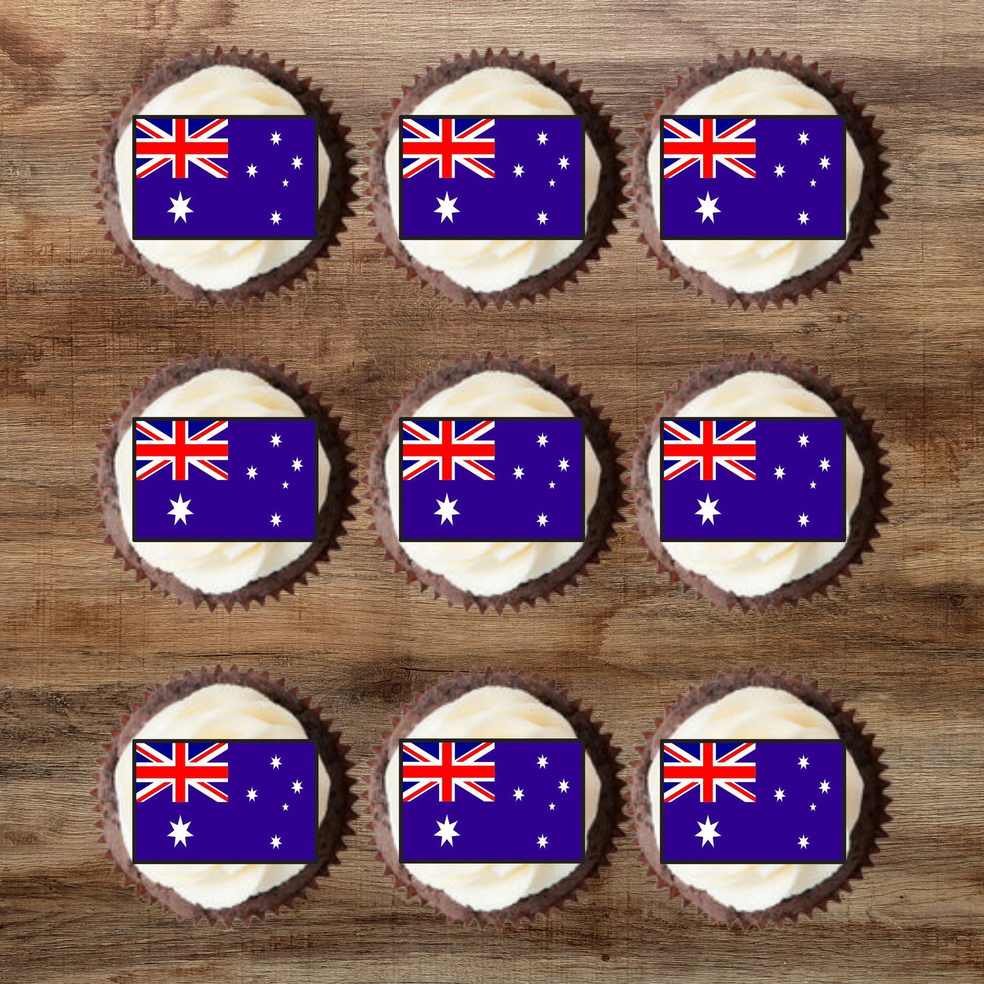 top view of nine Australian Flag Edible Cupcake Toppers on chocolate cupcakes with white frosting