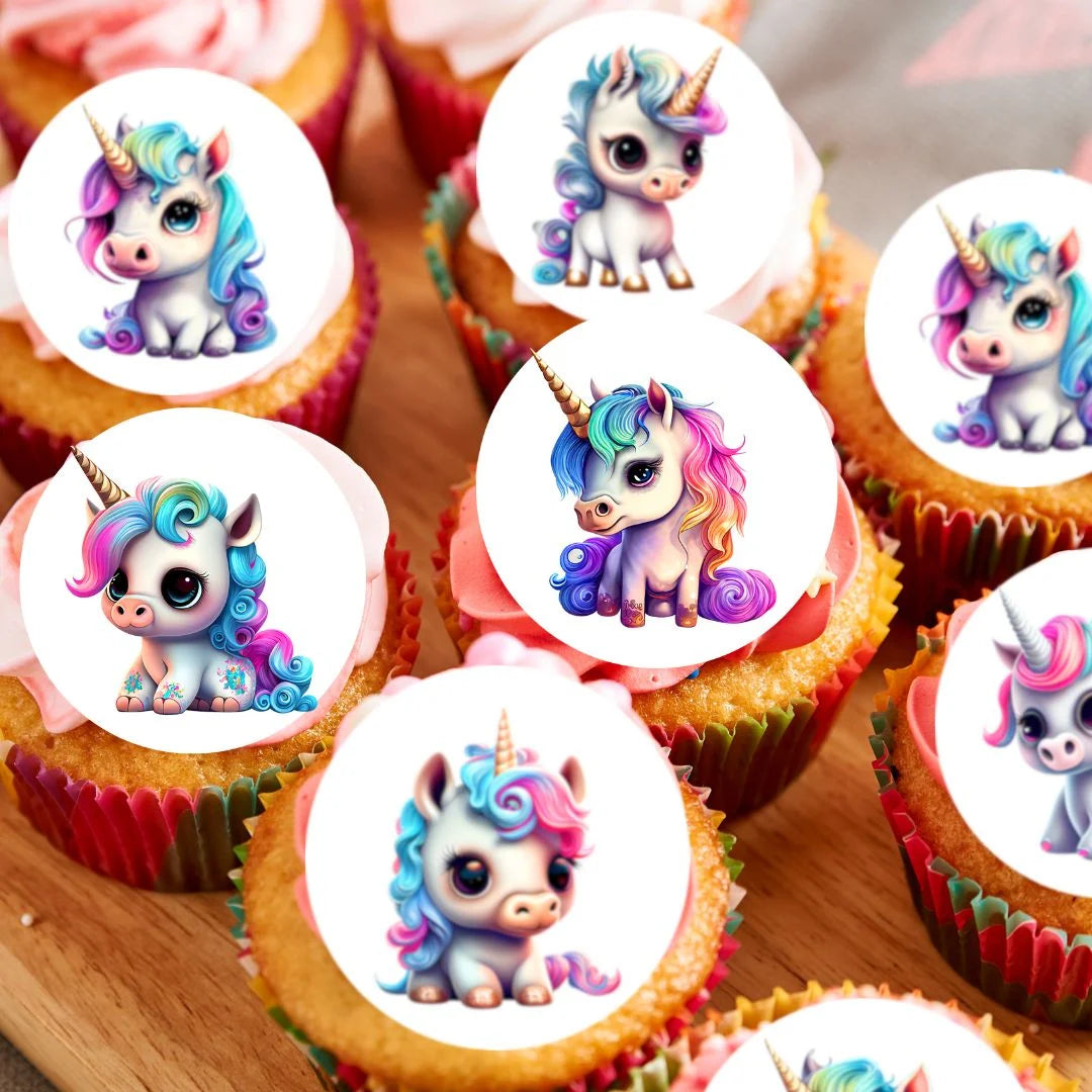 Baby Unicorn Edible Cupcake Toppers on white frosted cupcakes 