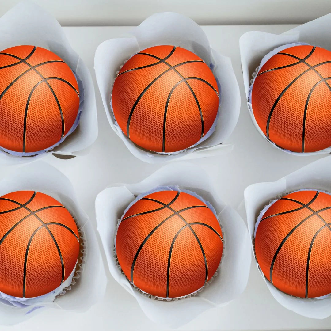 Basketball Ball Edible Cupcake Toppers on white frosted cupcakes