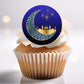 Cupcake with a decorative topper featuring a crescent moon and mosque design on a white background.