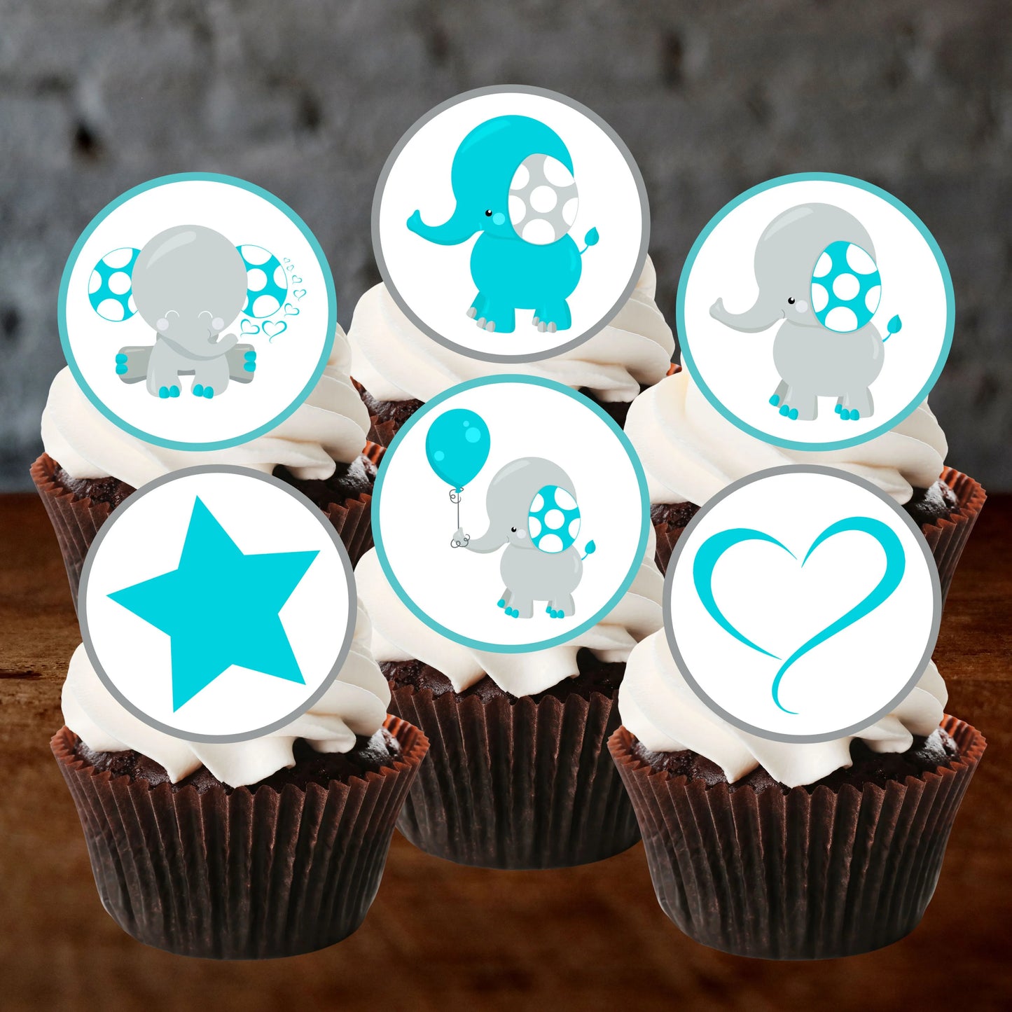 six chocolate frosted cupcakes with edible cake toppers featuring cute blue elephants