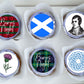 Cupcakes decorated with Scottish-themed designs including a flag, tartan pattern, thistle, and Celtic knot.