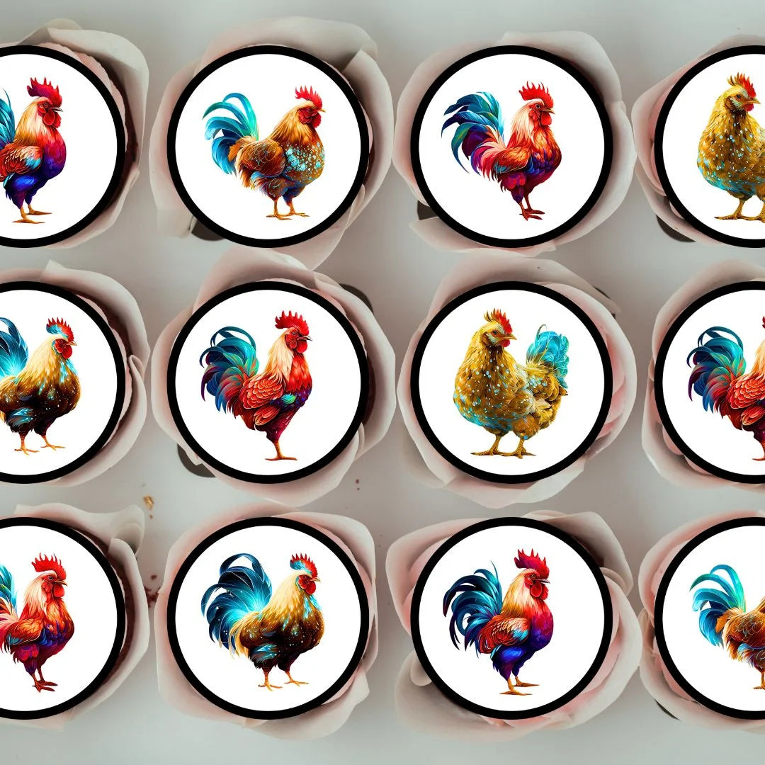 top view of frosted cupcakes topped with circular cupcake toppers. They feature colourful illustrations of chickens and cockerels