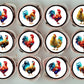 top view of frosted cupcakes topped with circular cupcake toppers. They feature colourful illustrations of chickens and cockerels