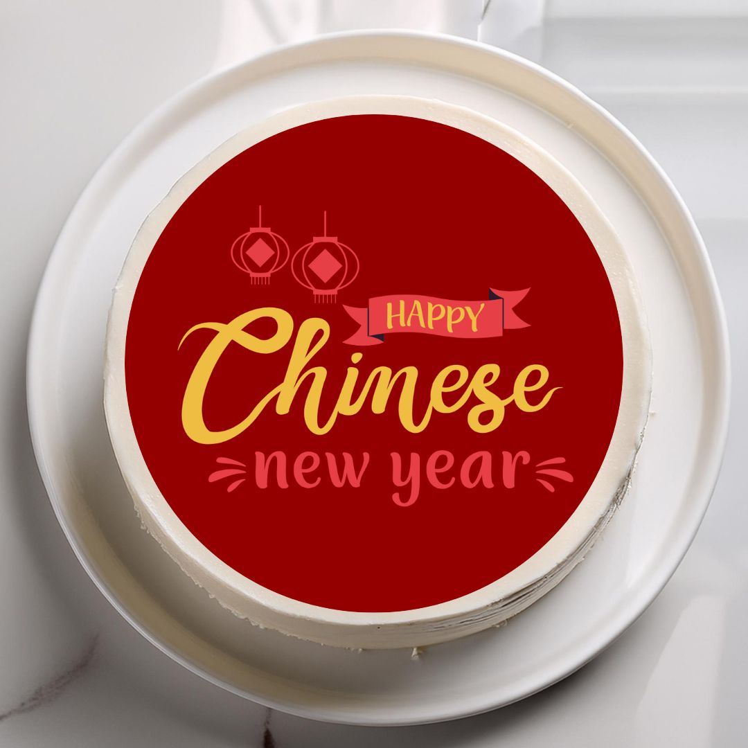 Cake with 'Happy Chinese New Year' text on a red background