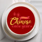 Cake with 'Happy Chinese New Year' text on a red background