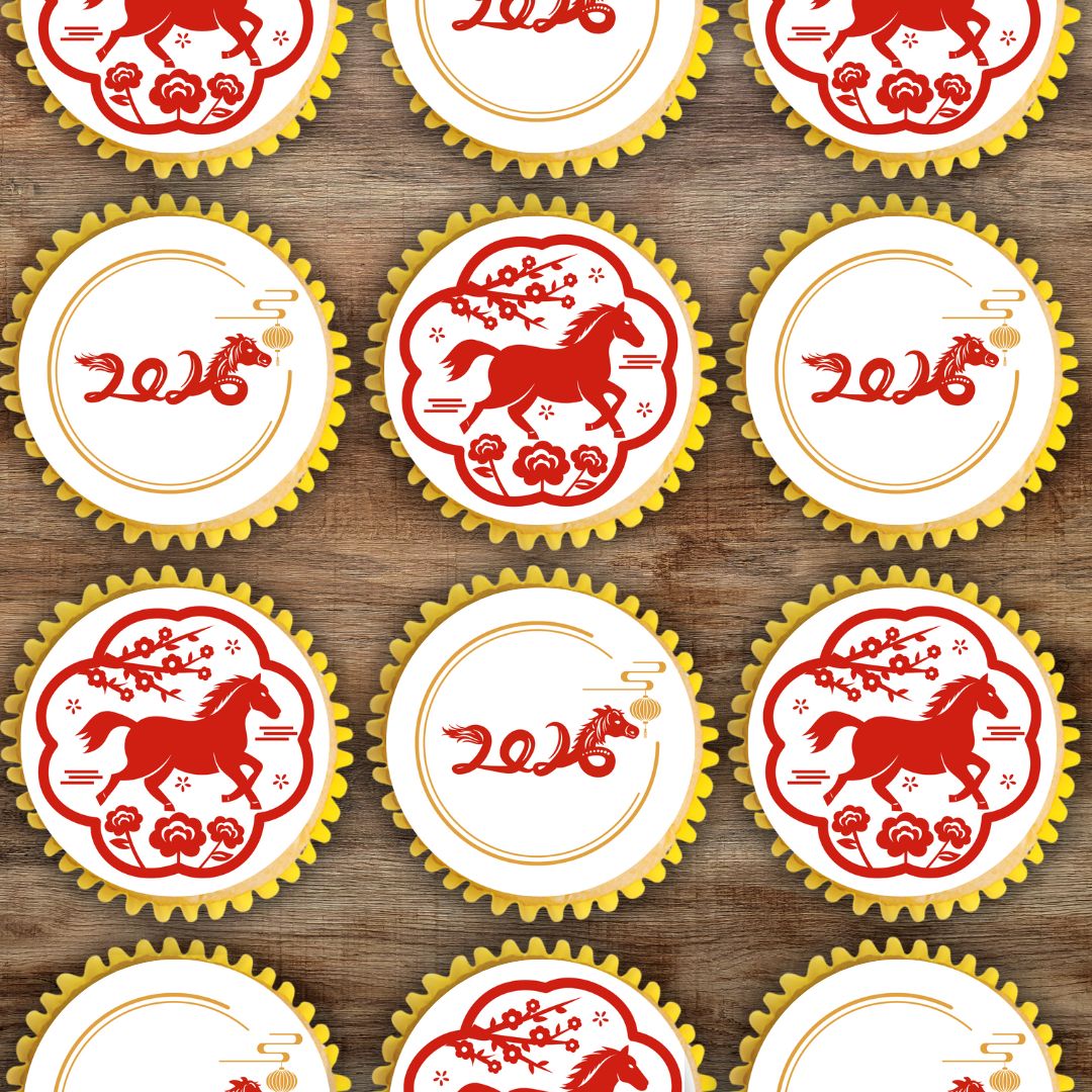 Cupcakes with red horse design and '2016' text on a wooden surface