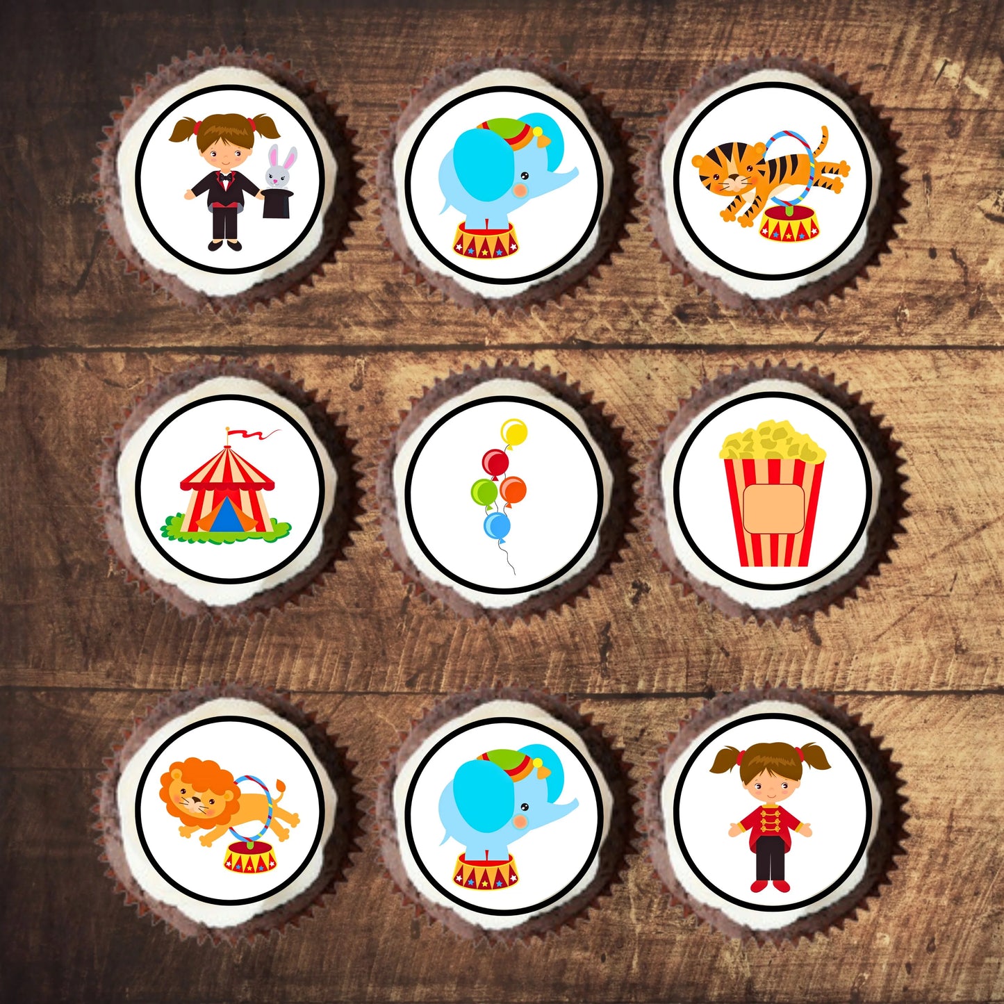 Circus Theme Edible Cupcake Toppers on cupcakes with white frosting