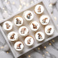 Coffee Gnomes Round Edible Cupcake Toppers on white frosted cupcake 