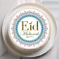 Decorative cake with 'Eid Mubarak' text on a white plate
