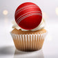 Cricket Ball Edible Cupcake Topper on a white frosted cupcake