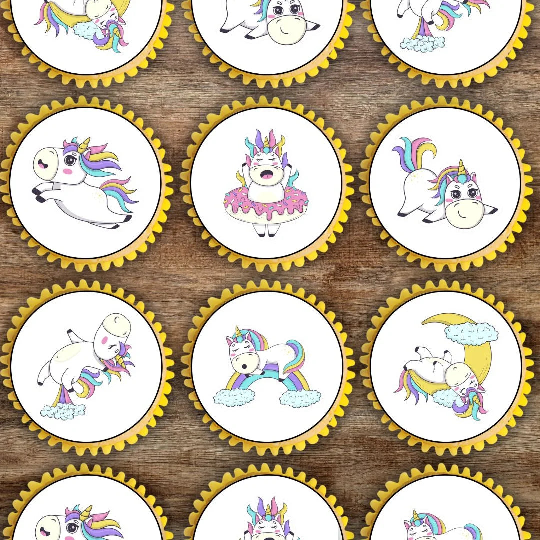 top view of white frosted cupcakes with cute unicorn illustrated cupcake toppers