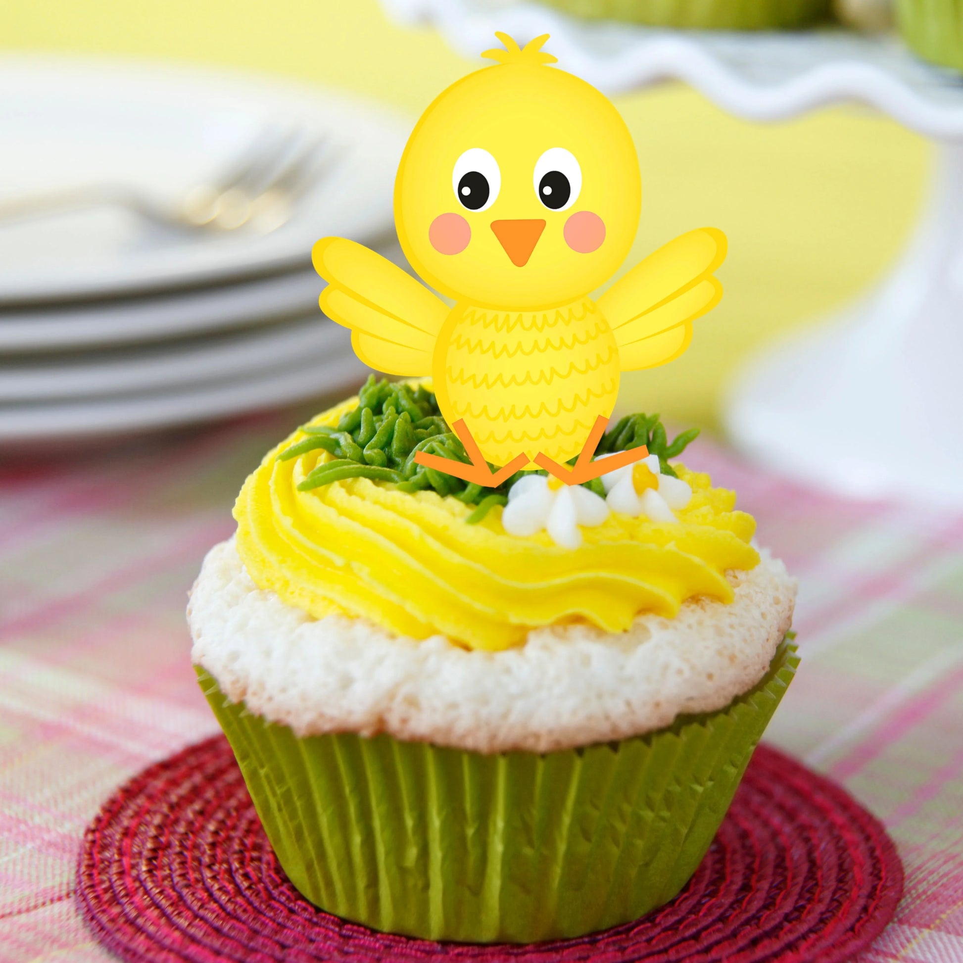 Easter Chick Edible Cupcake Topper on a cupcake with yellow frosting