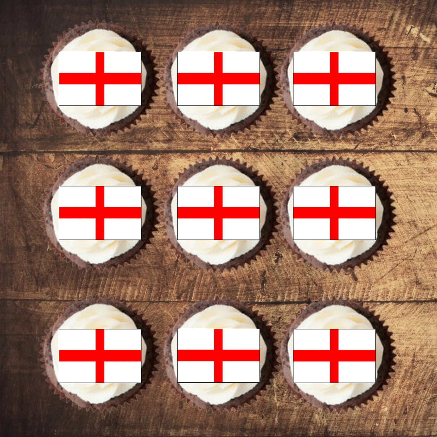 top view of England Flag Edible Cupcake Toppers on nine white frosted cupcakes 