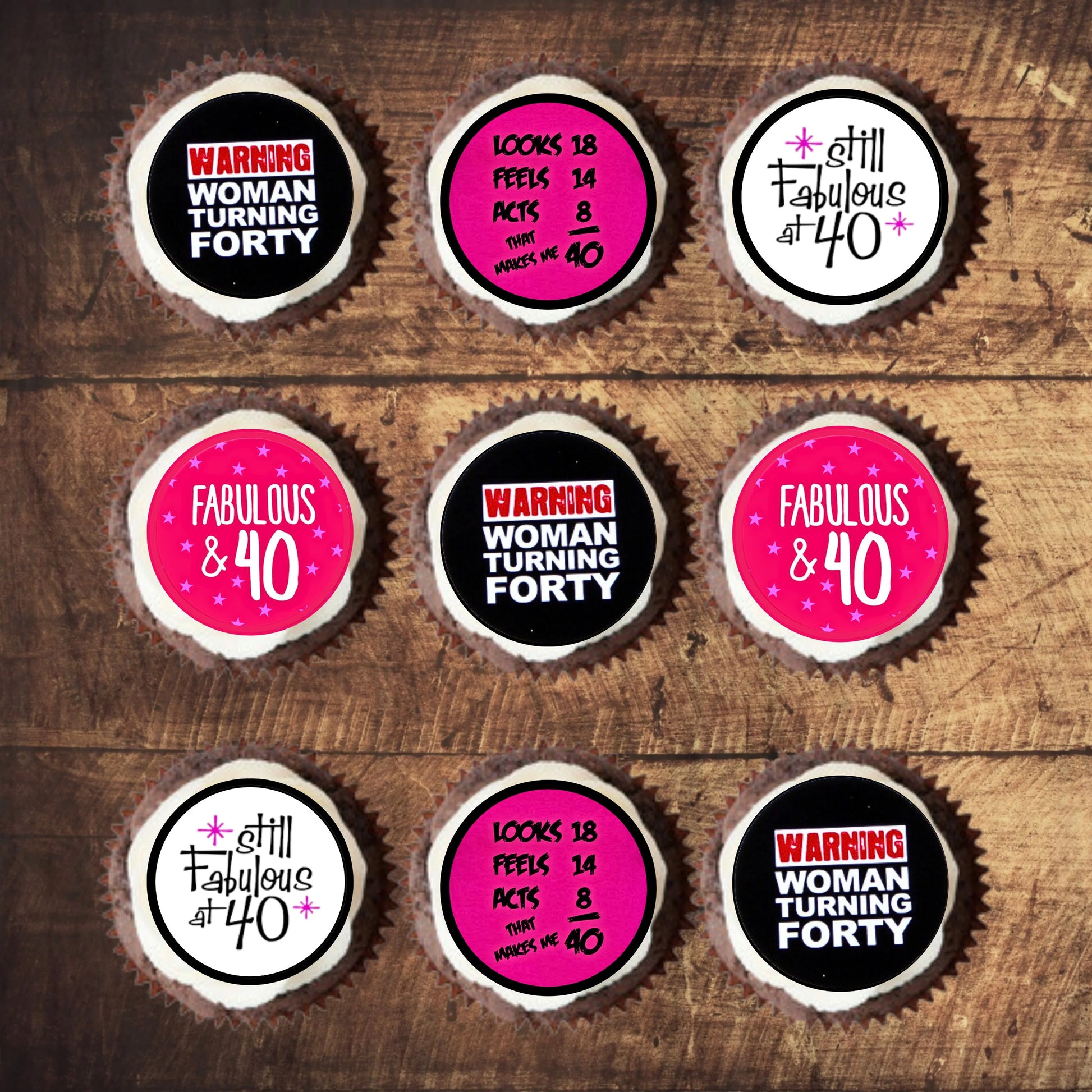 bright pink, black and white cupcake toppers with '40 and fabulous' slogans on white frosted cupcakes