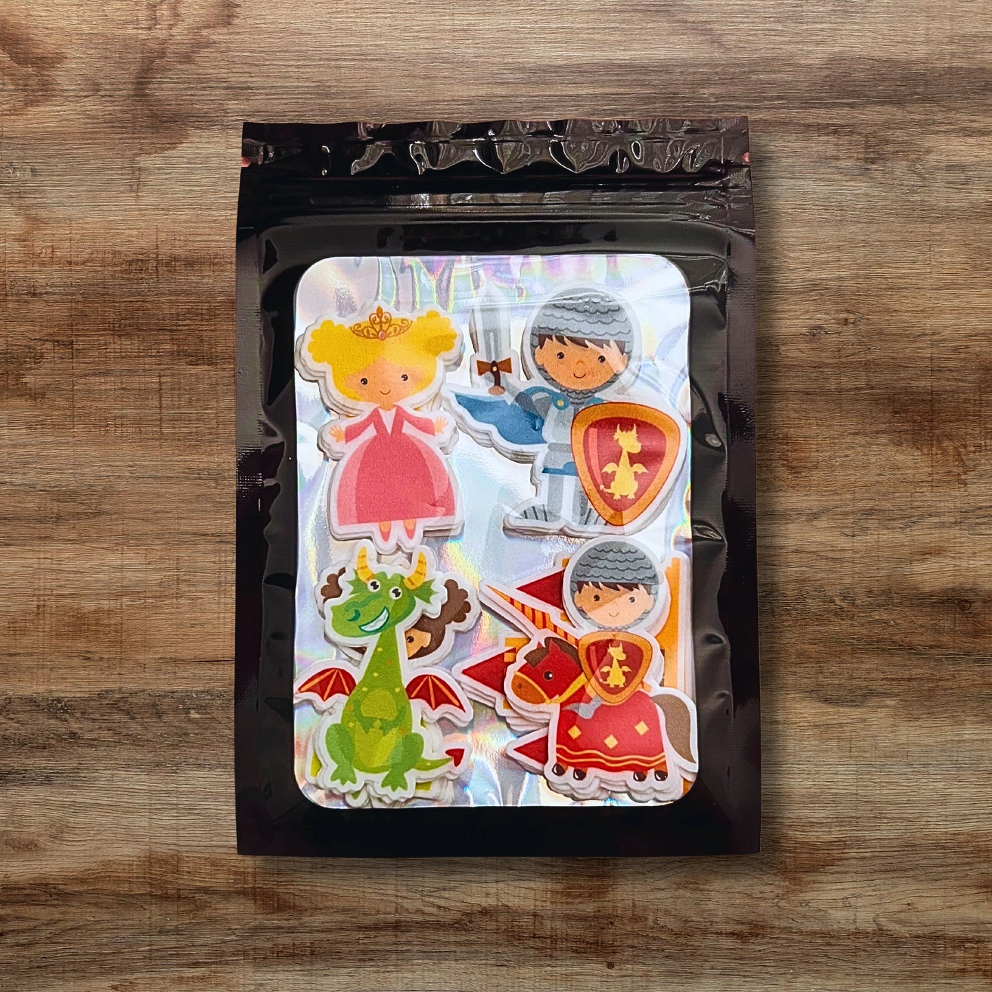 Fairytale knights, dragons and princess Edible Cupcake Toppers in black packaging