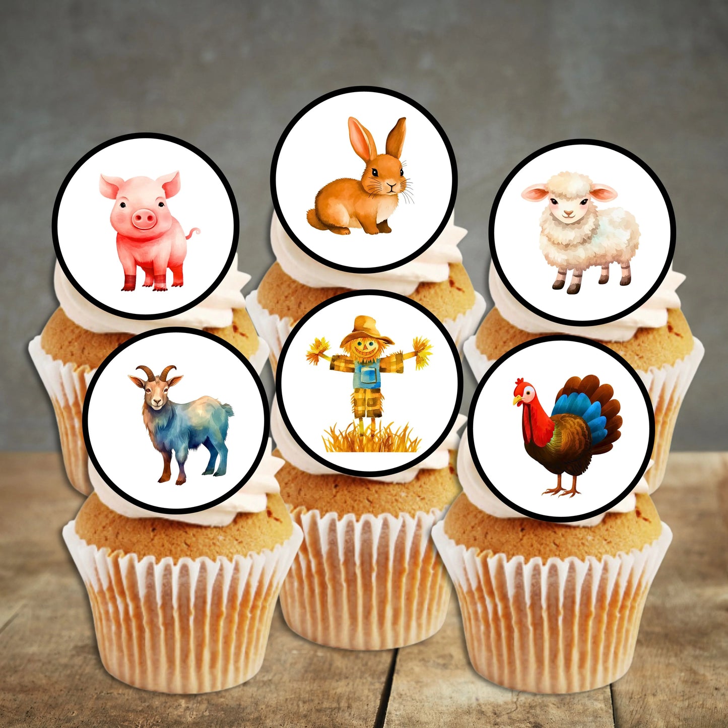 cupcakes with white frosting and circular farm animals cake toppers 