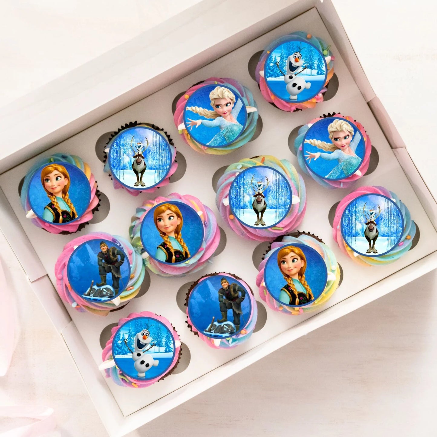 Frozen Princesses Edible Cupcake Toppers on chocolate cupcakes with white frosting 