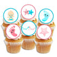 six white frosted cupcakes with Boy or Girl Gender Reveal Edible Cupcake Toppers with pink and blue illustrations