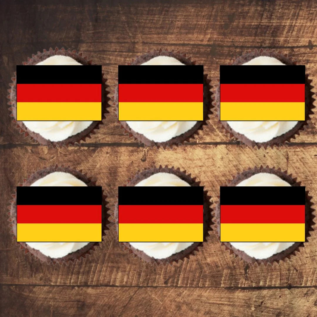 top view of German Flag Edible Cupcake Toppers on chocolate cupcakes with white frosting