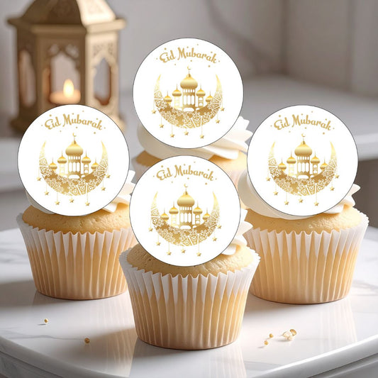 Cupcakes with 'Eid Mubarak' toppers on a white surface.