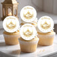 Cupcakes with 'Eid Mubarak' toppers on a white surface.