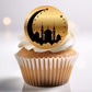Cupcake with a gold and black cupcake topper featuring a mosque silhouette.