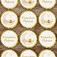Decorative labels with 'Ramadan Mubarak' text and crescent moon design on a wooden surface.
