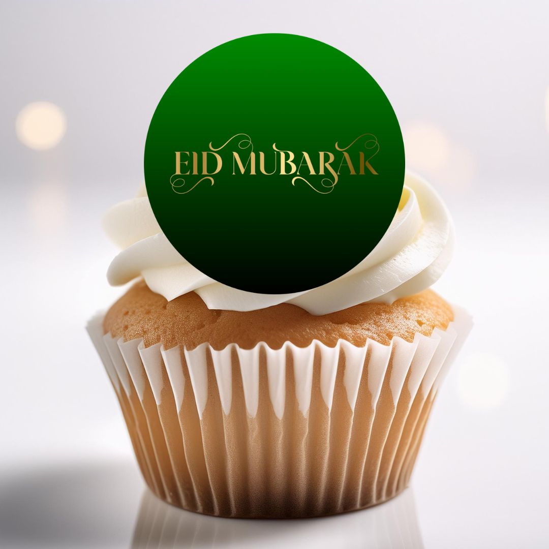 Cupcake with white frosting and a green 'Eid Mubarak' topper on a light background
