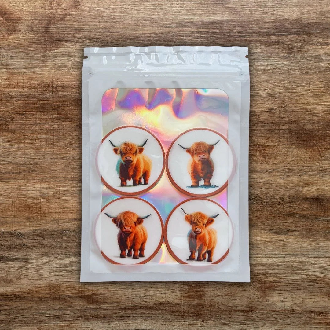 highland cow cupcake toppers in packaging 