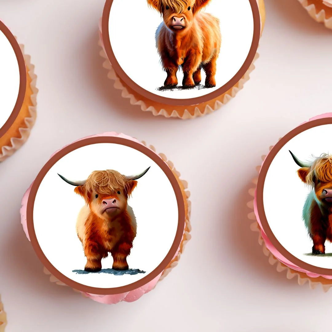 close up of highland cow cupcake toppers on frosted cupcakes