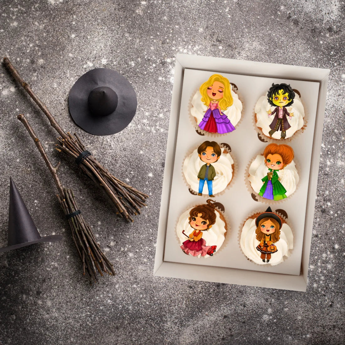 Hocus Pocus Theme Edible Cupcake Toppers on top of white iced cupcakes 