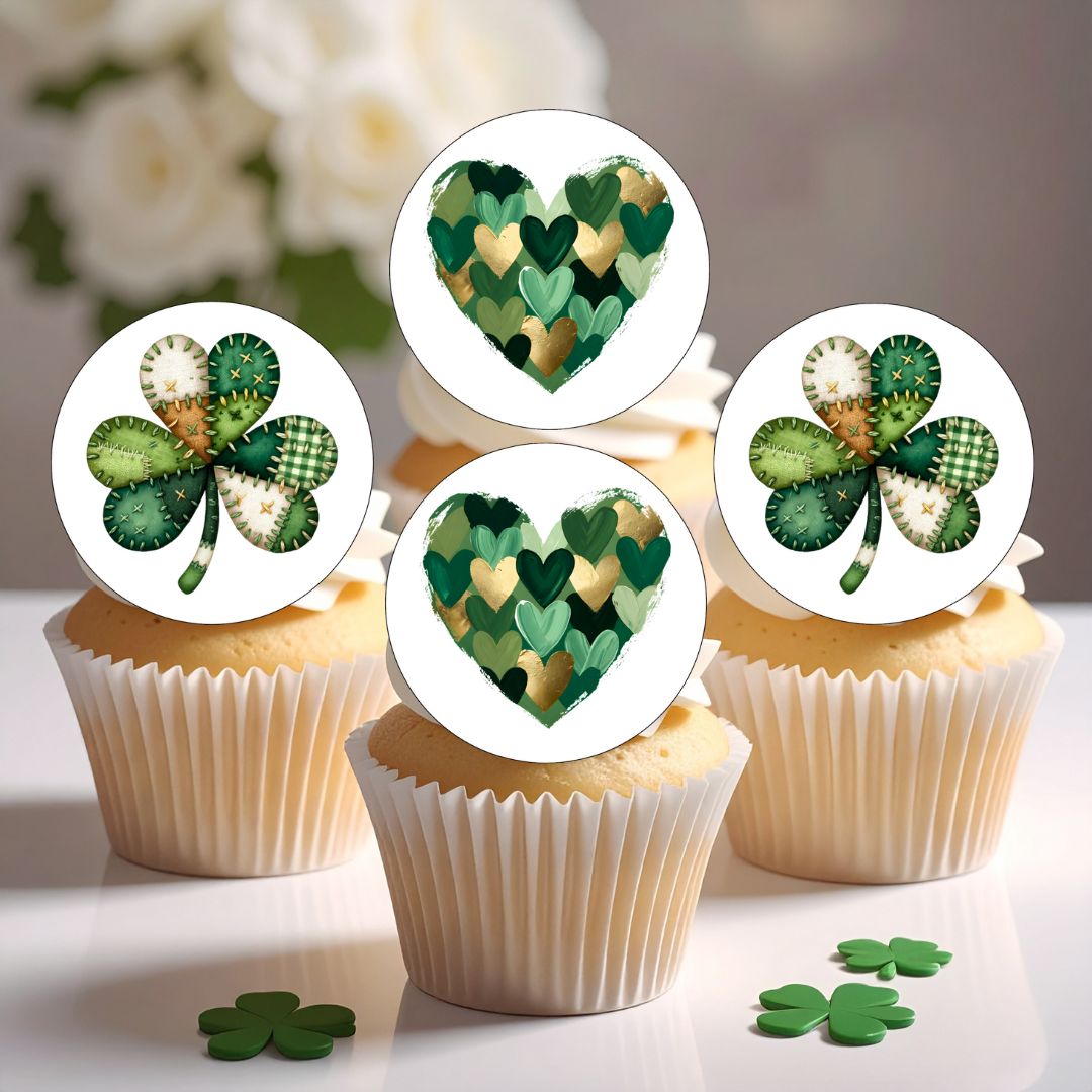 Cupcakes with shamrock and heart-shaped green decorations on white background