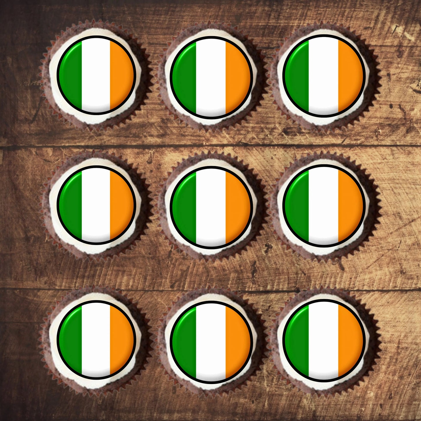 top view of Ireland Flag Round Edible Cupcake Toppers on sponge cupcakes with white frosting 