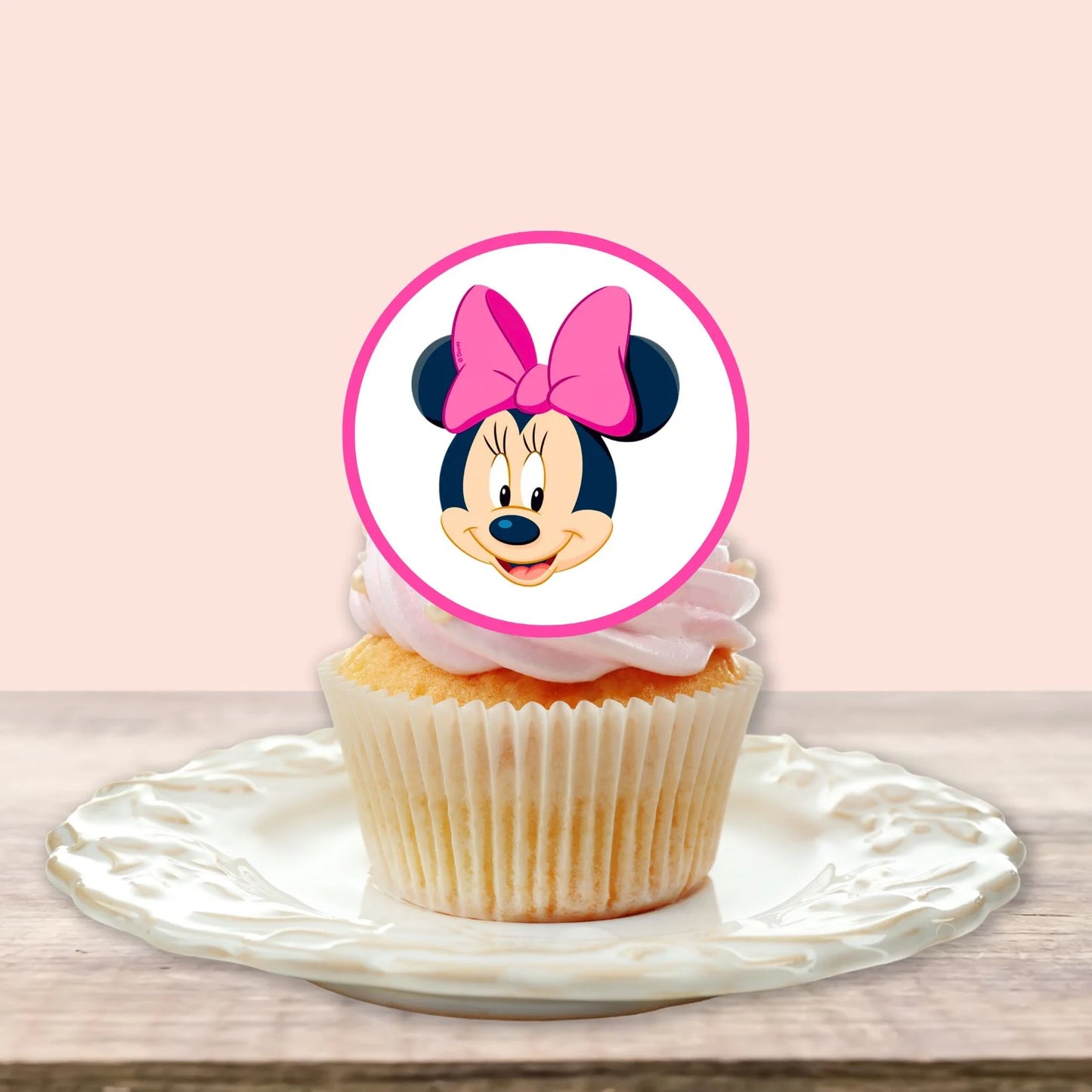 Minnie Mouse Pink Edible Cupcake Toppers on white frosted cupcakes 