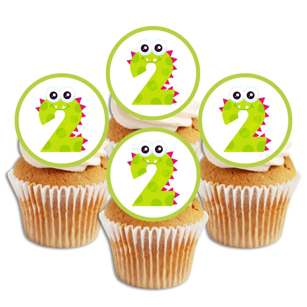 edible cupcake toppers with a green monster themed number 2 on white frosted cupcakes 